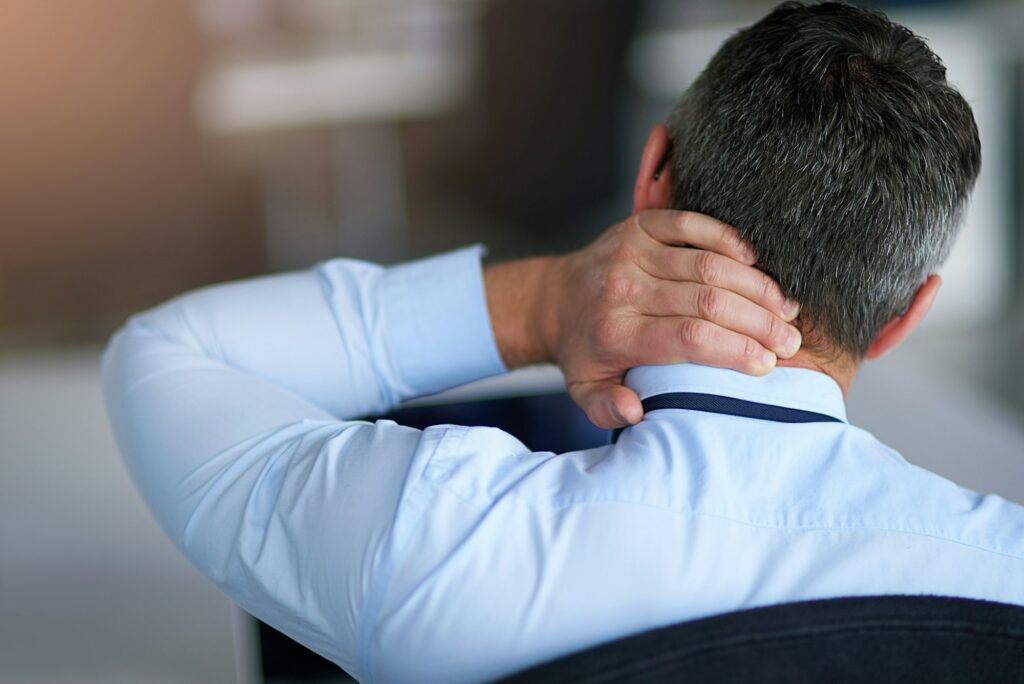 This day has been a pain in the neck. Shot of a businessman suffering from neck pain.